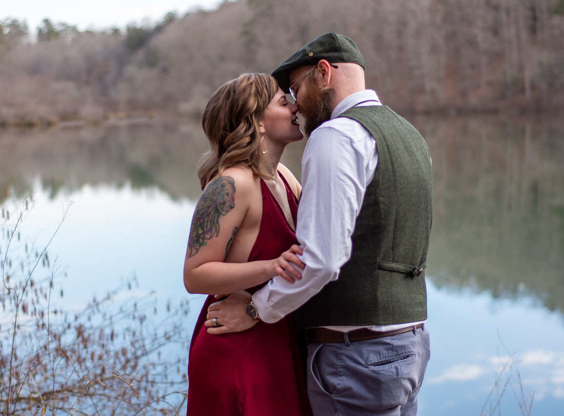 Couple sharing a quiet moment beside the water