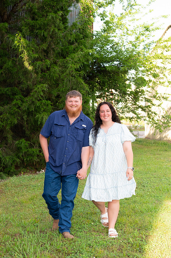 Couple walking hand in hand outdoors